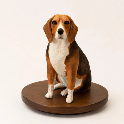 Hand-painted custom dog figurine displayed with a reference photo